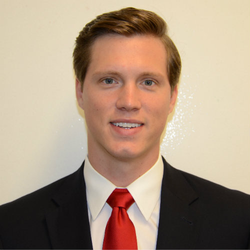 A headshot of Andrew Stout.